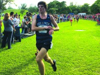 Senior Franco Caputo crosses the finish line at the King of the Hill meet. Caputo is one of the captains of the team. He has been on the team since his freshman year. Photo by Tyler Perez. 