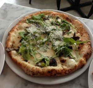 The fungi pizza is another popular choice on the menu. It includes porcini mushrooms, smoked mozzarella, parmesan, arugula, and olive oil. Photo by Jessica Rolnick