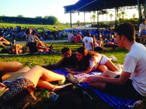 Juniors Gabriela Telepman, Jaclyn Soria and Jake Soria wait on the lawn area at Coral Skies festival for the next band to start playing.  The one-day festival brought in many popular indie artists. Photo by Estefania Martinez