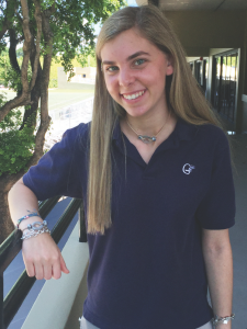 After volunteering at VACC Camp for two years, junior Catie Schwartzman began to make necklaces under the charity name "Breathe by C. Sloane." Once she can, Catie plans to donate all of the proceeds to the camp itself. To purchase a necklace, either find Catie at school or go to her Facebook page "Breathe by C. Sloane." Photo by Monica Rodriguez.