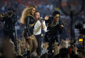 Beyonce, left, sings with Chris Martin of Coldplay and Bruno Mars, right, during the halftime show at Super Bowl 50 at Levi's Stadium in Santa Clara, Calif., on Sunday, Feb. 7, 2016. (Nhat V. Meyer/Bay Area News Group/TNS)