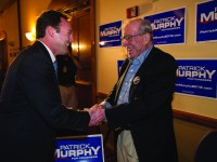 Patrick Murphy, who is running against Rep. Allen West (R-Fla.), greets Warren Grossman during an election night watch party at the Double Tree hotel in Palm Beach Gardens, Florida on Tuesday, November 6, 2012. (Thomas Cordy/Palm Beach Post/MCT)