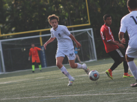 Junior Ross Shellow passes the ball to a teammate during one of the team’s game. The Raiders have won six games so far this season. Photo by Lily Harris.